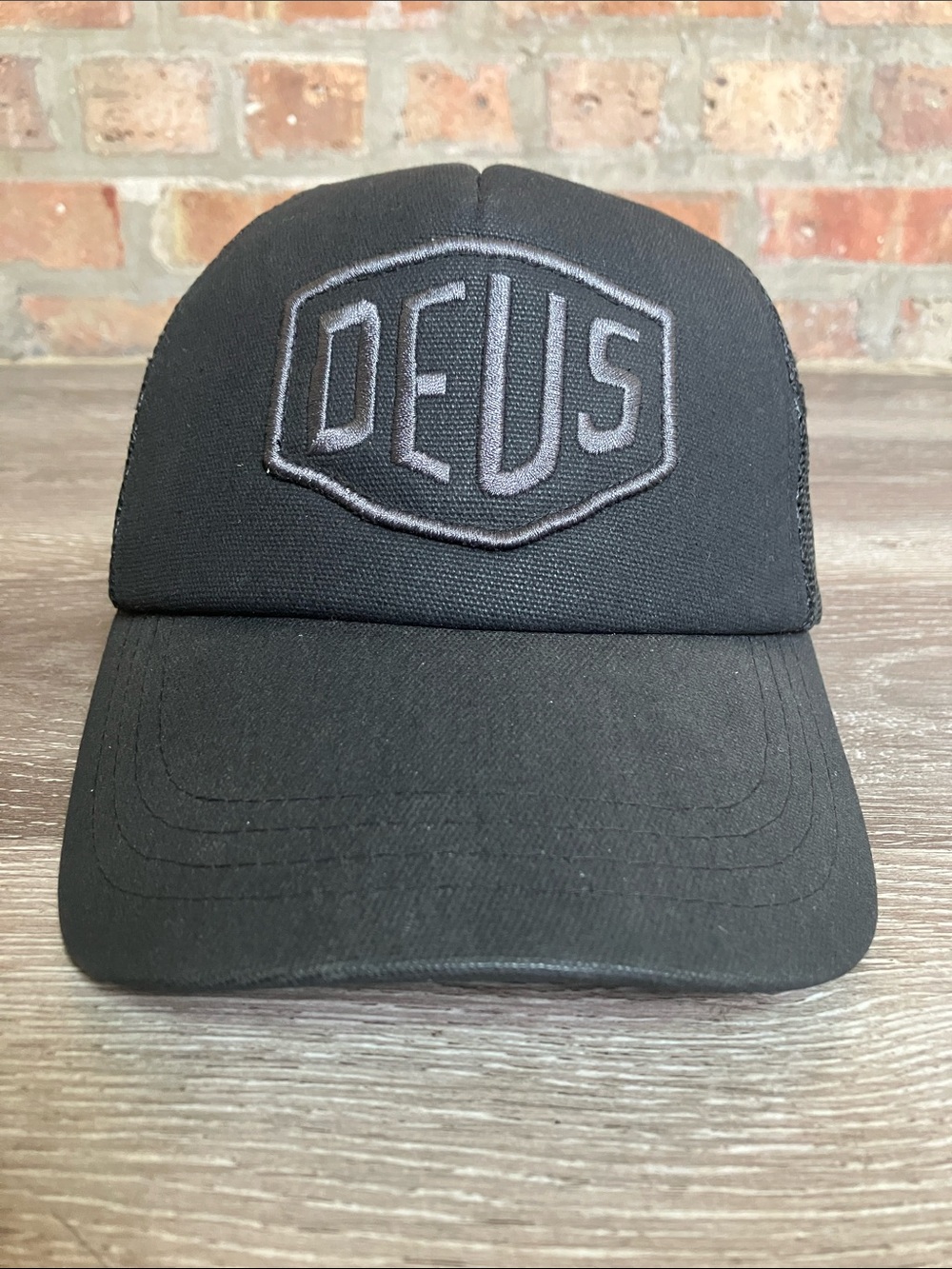 DEUS Ex Machina Black Logo Trucker Hat